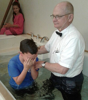 Fathers in the Field - Pastor Mike baptizing Isaiah
